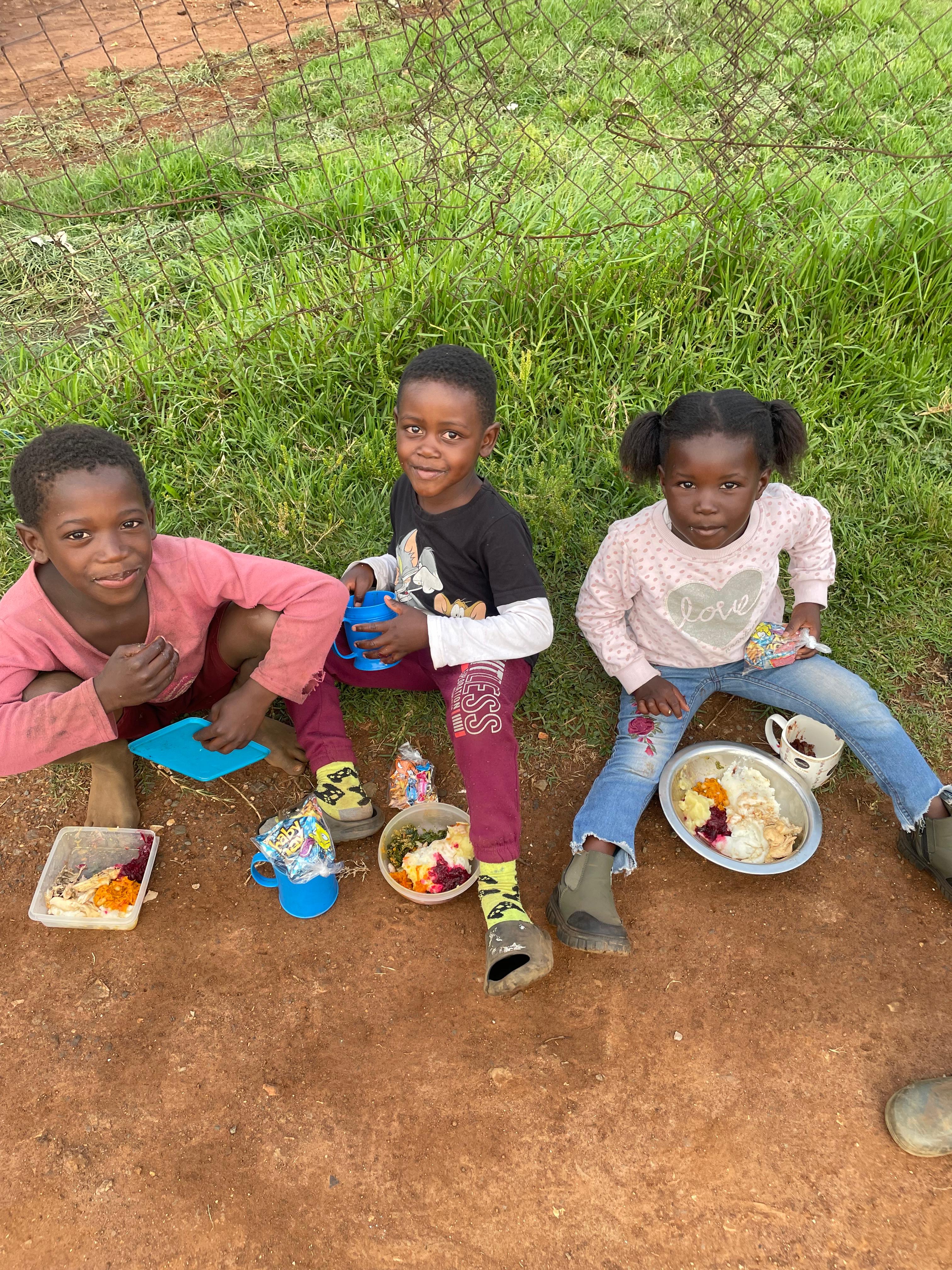 Kids eating their first meal